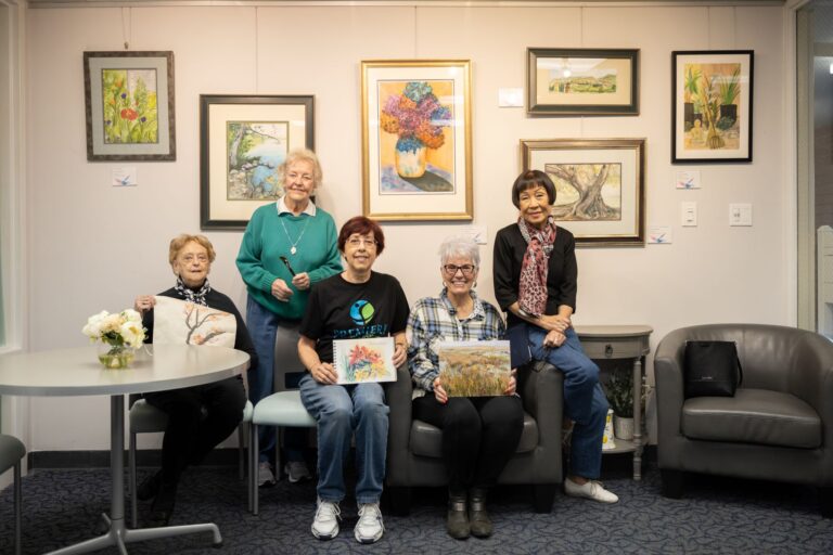 seniors with their paintings