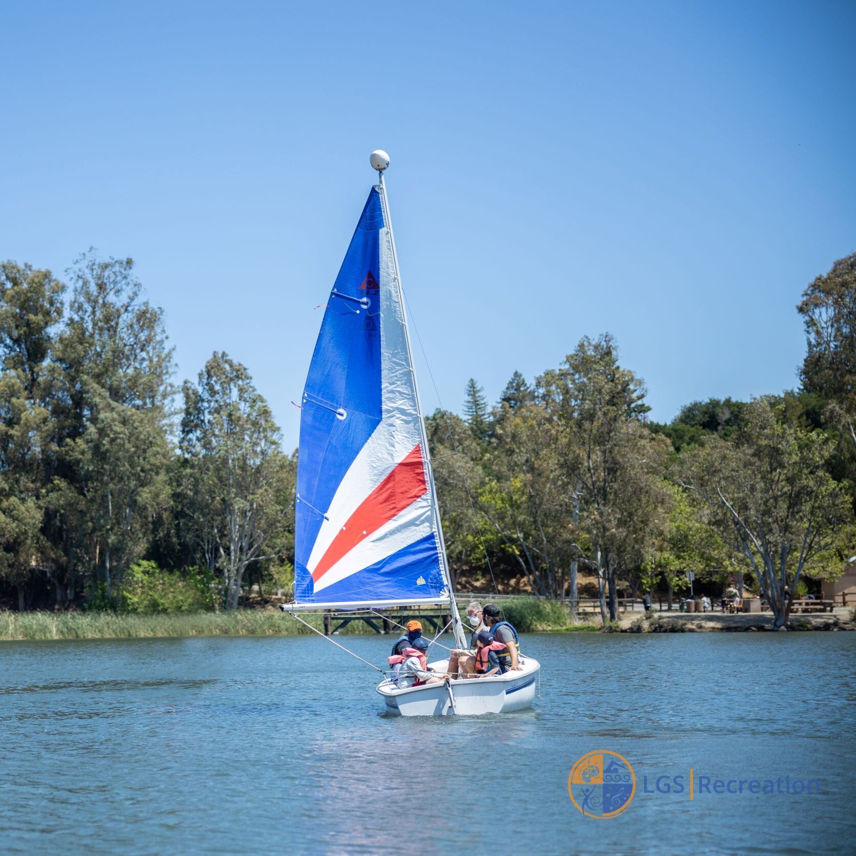 sailboat on vasona lake with group on boat