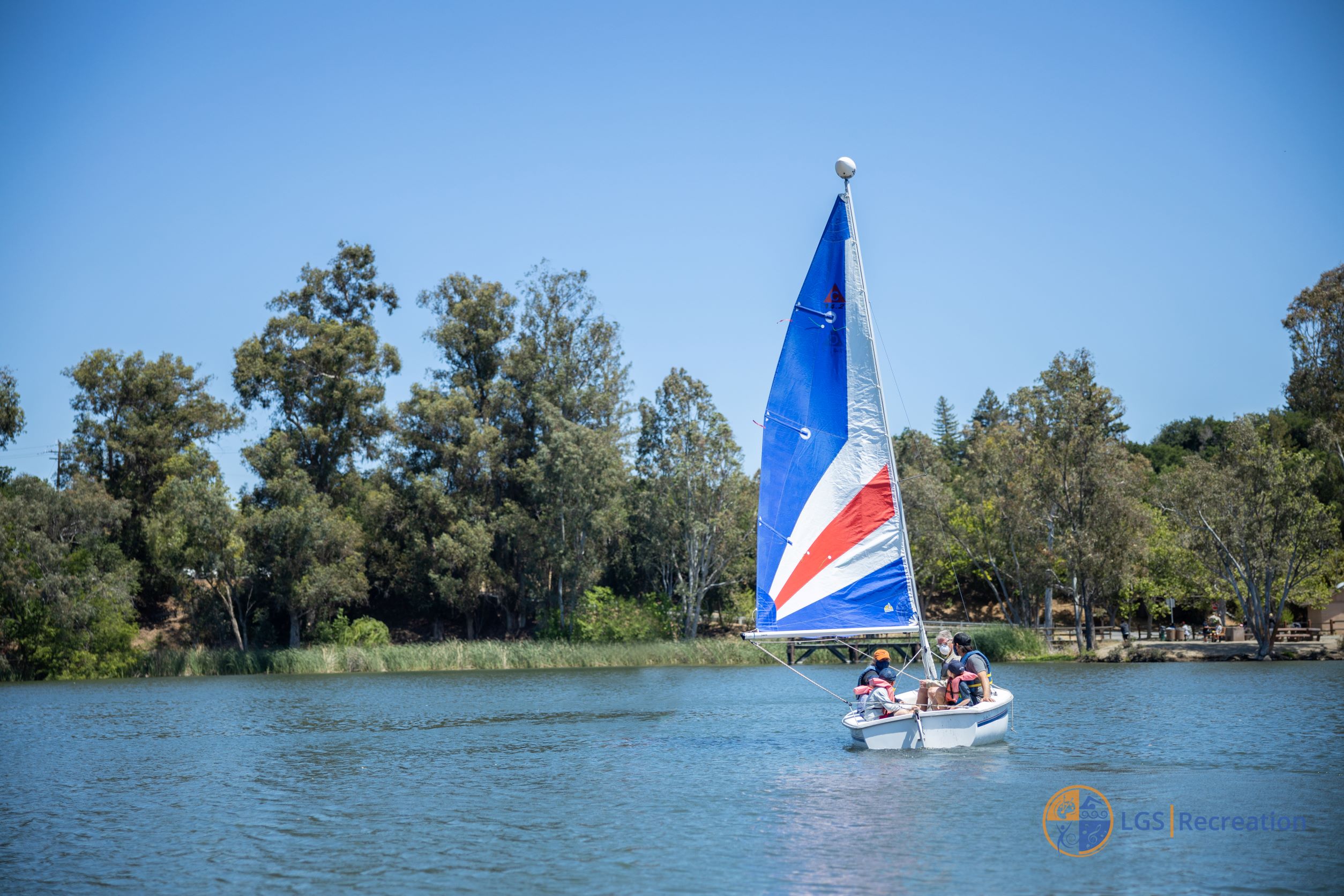 sailboat on vasona lake with group on boat