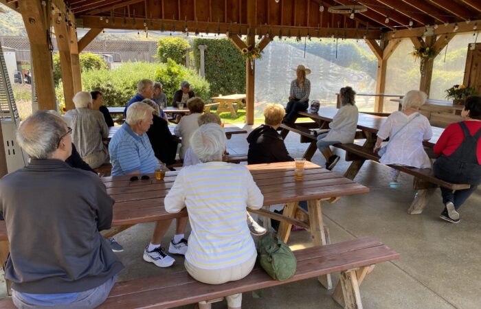 Monterey Bay trip group picnic tables listening to a docent