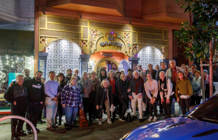 De Young trip participants group photo in front of restaurant