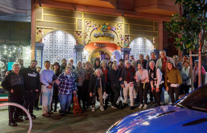 De Young trip participants group photo in front of restaurant