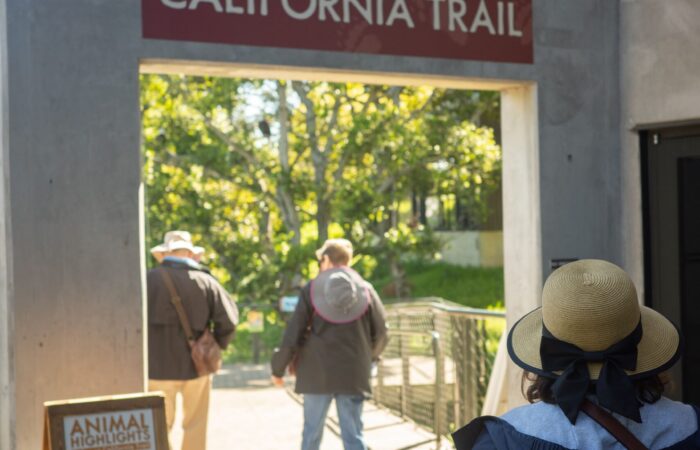 Oakland Zoo trip participants passing a sign for the calrifornia trail