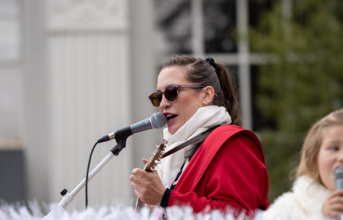 Holiday parade woman singing