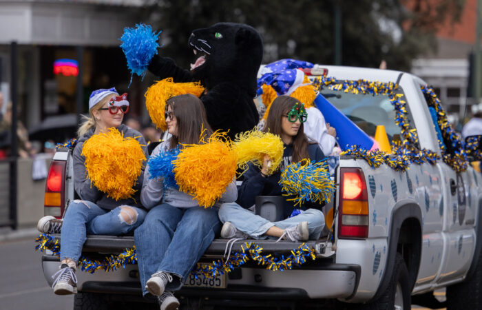 Holiday parade cheerleaders on truck float