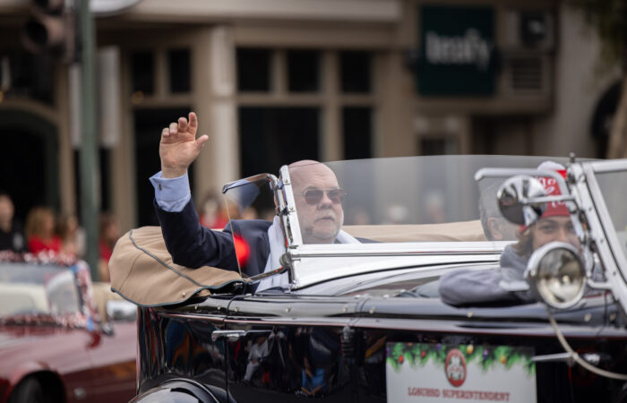 Holiday Parade guys in a classic car