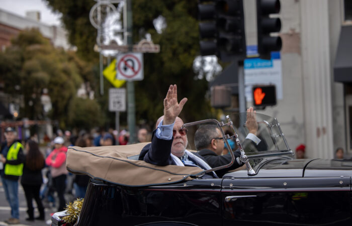 Holiday Parade guys in a classic car