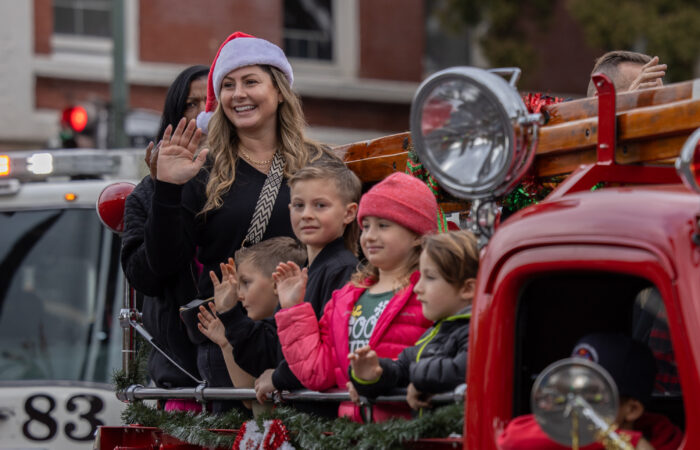 Holiday Parade kids on an old fire truck