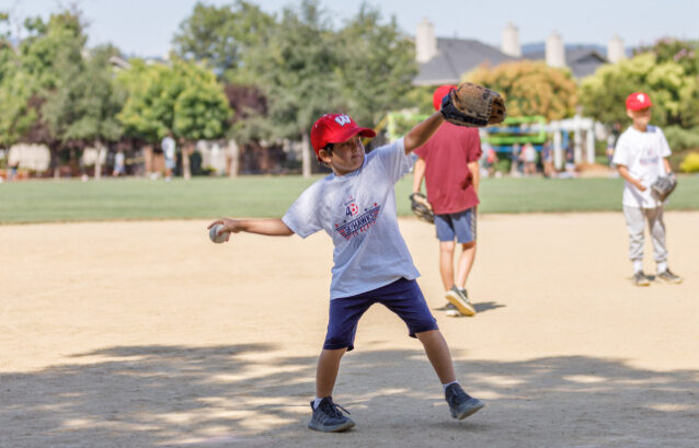 kids playing baseball, kid thwoing the ball