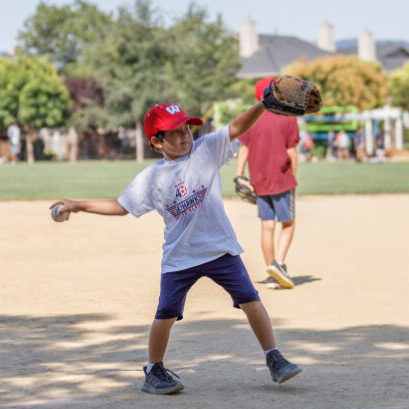 kids playing baseball, kid thwoing the ball