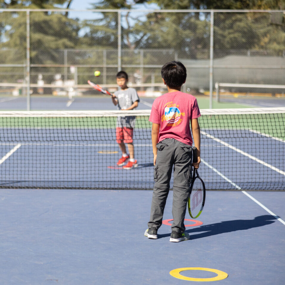 Kids playing tennis games