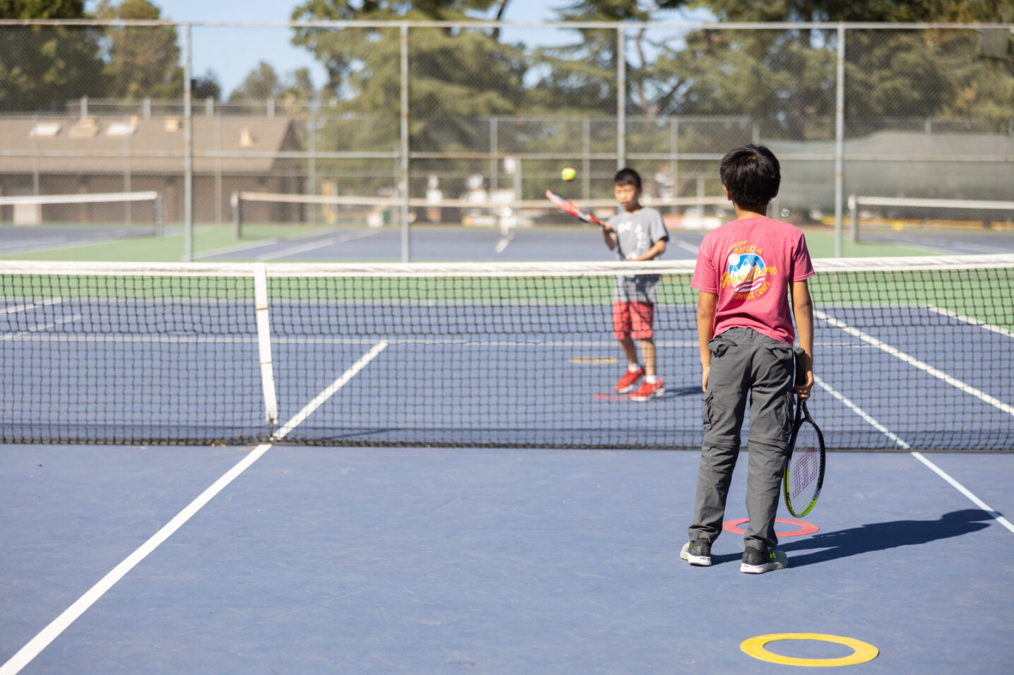 Kids playing tennis games