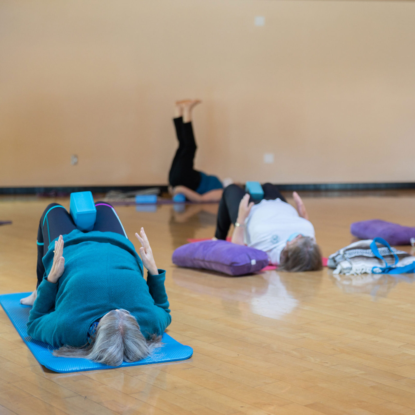 adults doing yoga