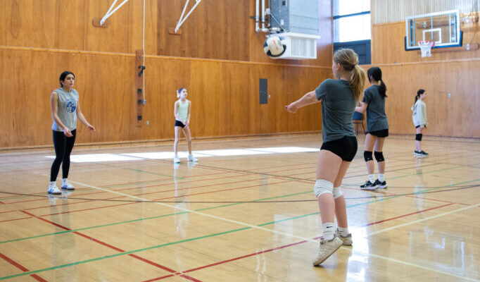 Girls playing volleyball