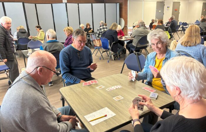 Game day seniors playing bridge