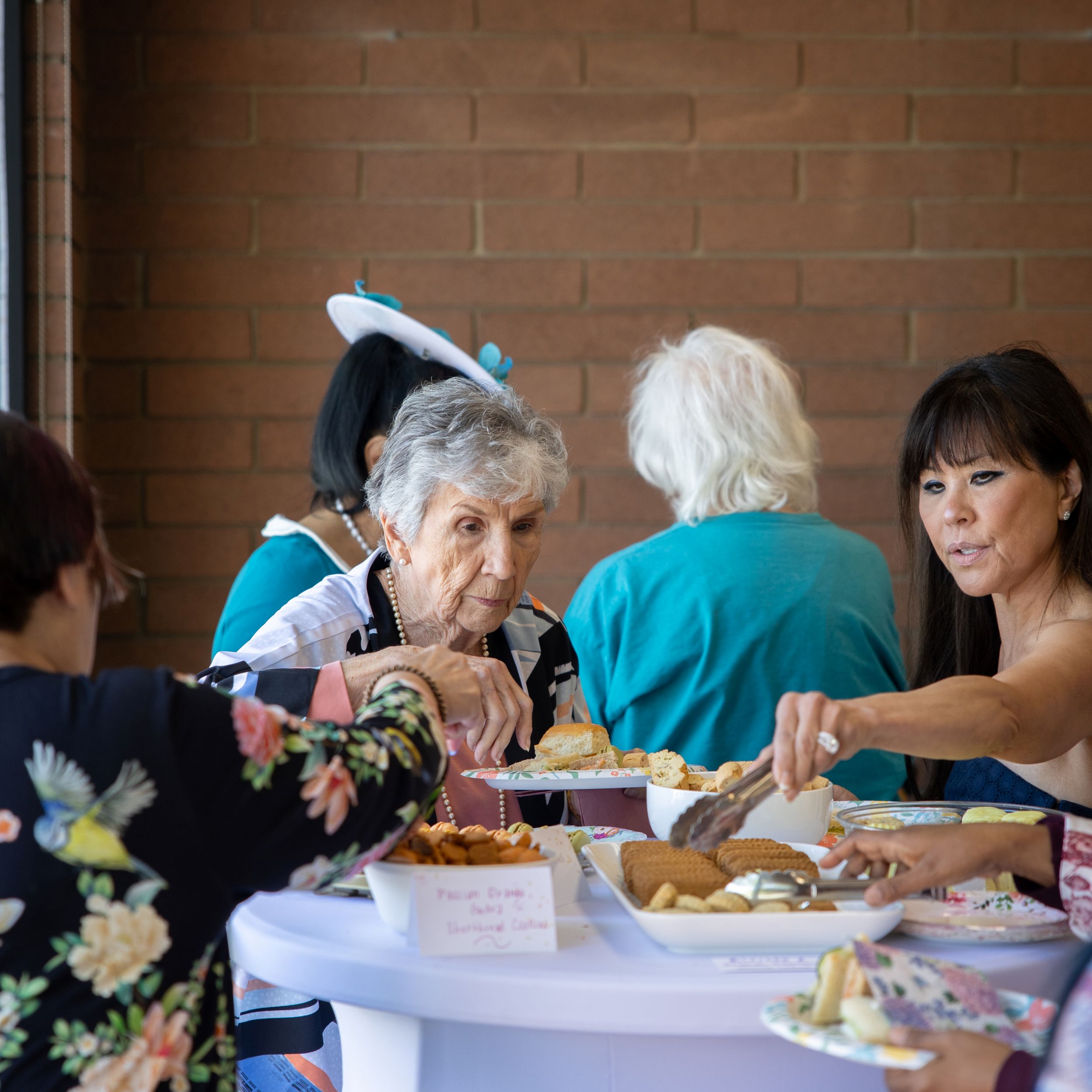 seniors at table for 55 plus event