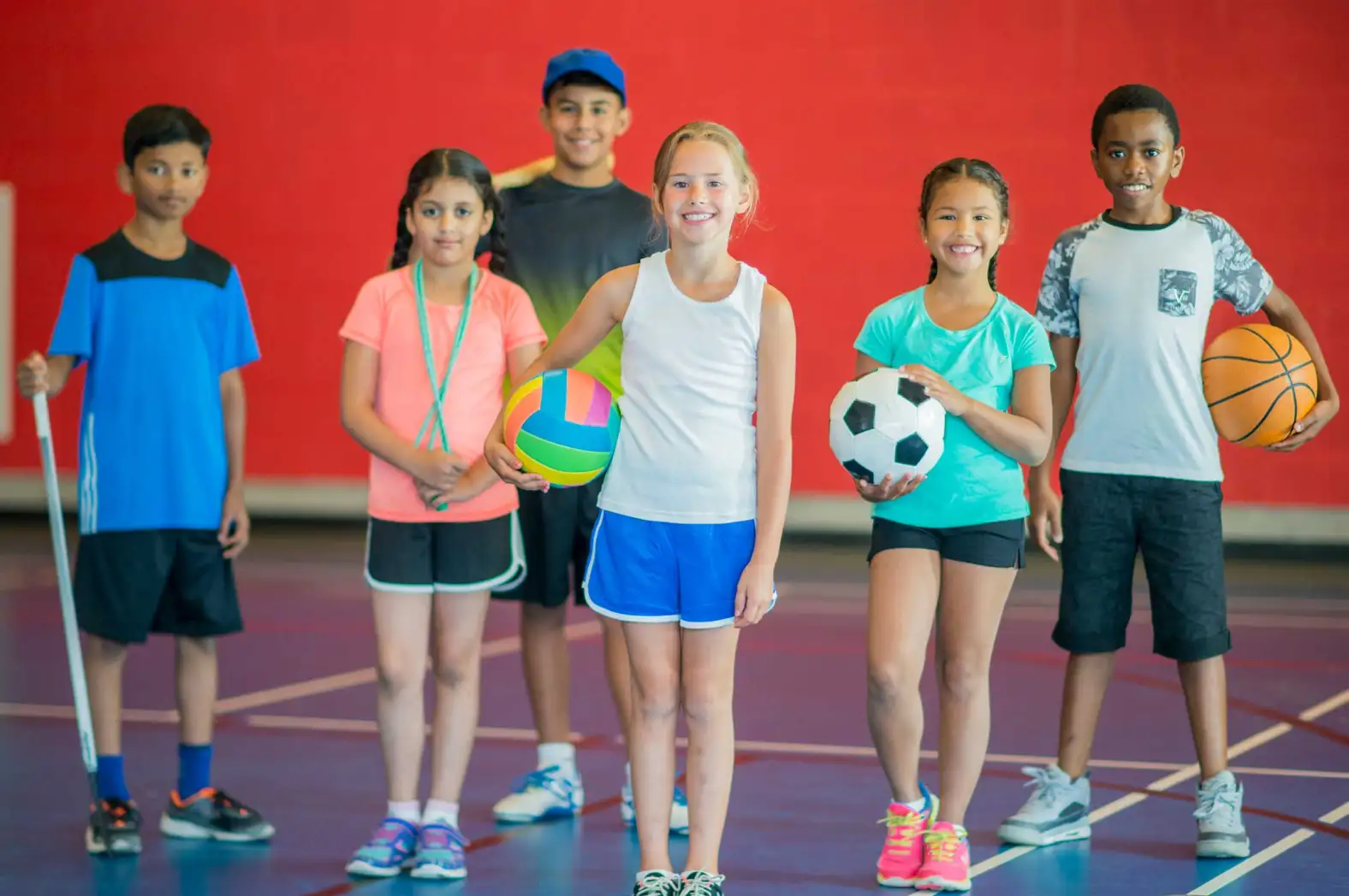 kids with different sport balls