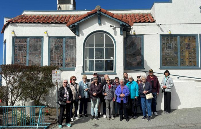 GhostsnGoats Group photo in front of a white building