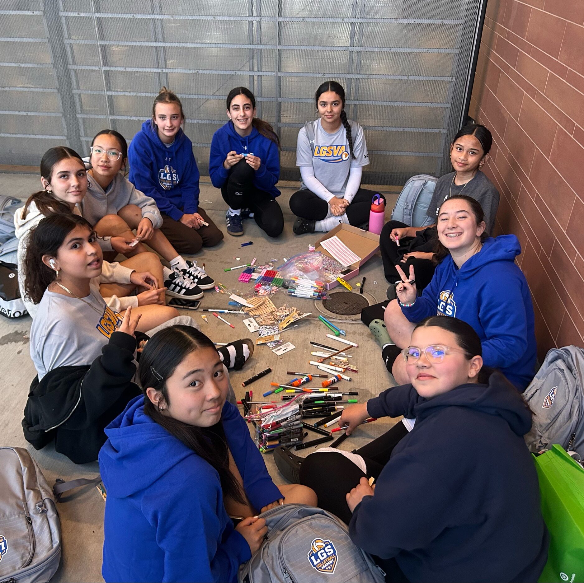 Volleyball players in a group with art supplies